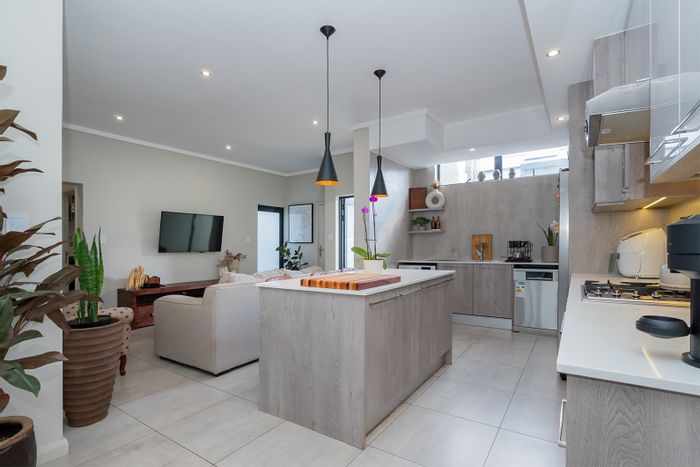 For Sale: Rynfield Townhouse with garden, parking, solar geyser, and pre-paid electricity.