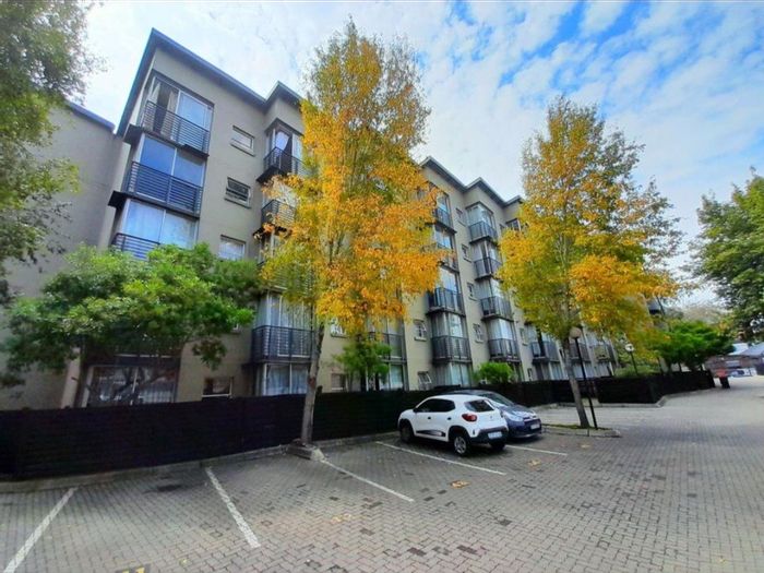 Braamfontein Apartment For Sale: Open-plan living, pool access, near universities.