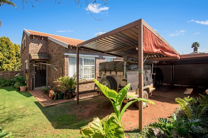 Townhouse For Sale in Weltevreden Park: 2 beds, loft, pet-friendly garden, double garage.