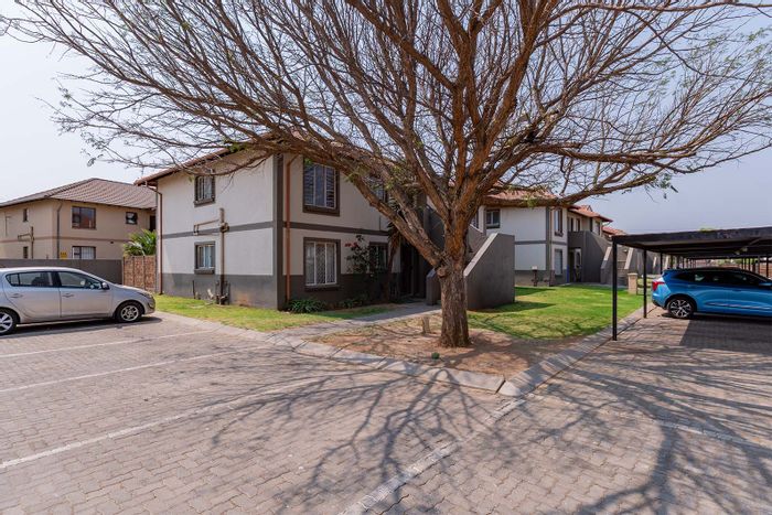 For Sale: Townhouse in Parkrand with pool, gardens, and security features.