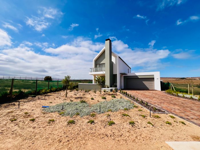 For Sale: House in Langebaan Country Estate with golf course access and scenic views.