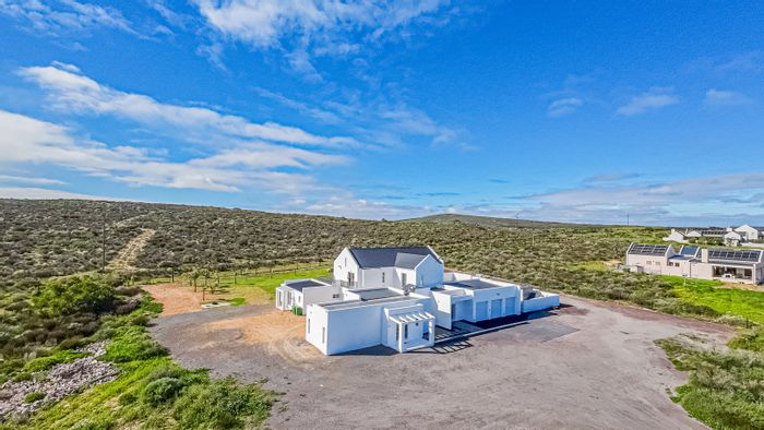 Spacious 6-bedroom house with flatlet, garages, and expansive outdoor space in Long Acres.