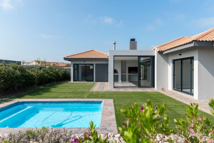 For Sale: 4-Bedroom House in Langebaan Country Estate with pool, garden, and garage.