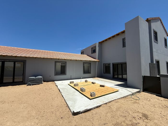 For Sale: House in Langebaan Country Estate with pool, garage, and golf cart space.