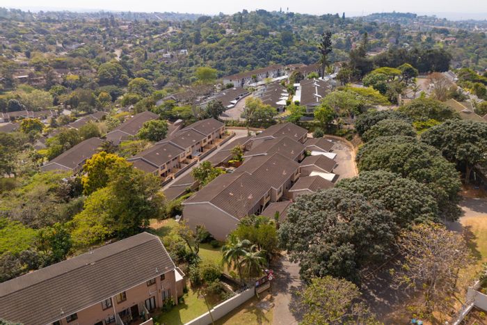 Spacious 3-bedroom apartment with private garden and dual garages in The Wolds, For Sale.