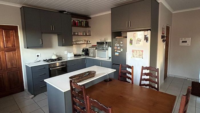 Townhouse for Sale in Van Der Hoff Park: 3 Bedrooms, Private Garden, Spacious Garage.