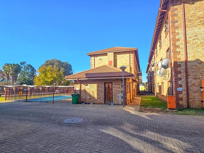 For Sale: Apartment in Potchefstroom Central with rental income, pool, and security.