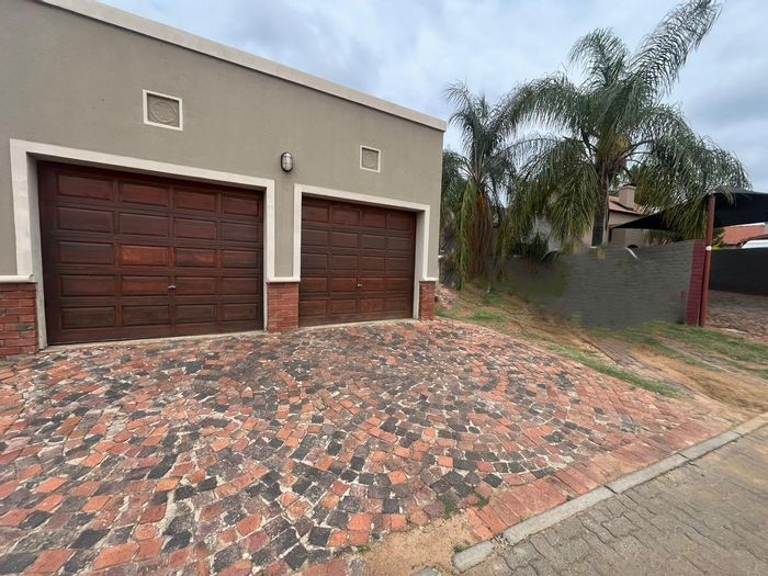For Sale: Townhouse in Waterval East with 2 beds, garden, and double garage.