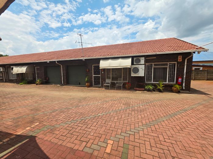 Two-bedroom townhouse for sale in Rustenburg Central, near amenities and pool.
