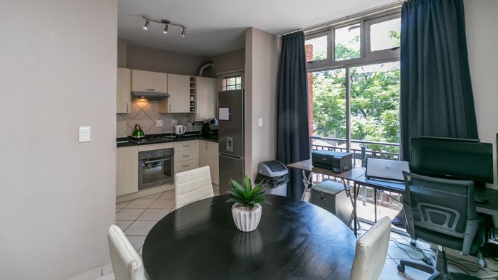 Two-bedroom apartment for sale in North Riding with pool, laundry, and parking.