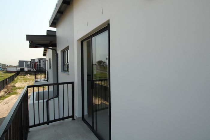 The Conifers Apartment For Sale: Open-plan living, private balcony, prepaid utilities.