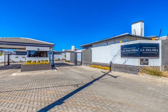 For Sale: 3-Bedroom Townhouse in Homes Haven with open-plan living and outdoor braai area.