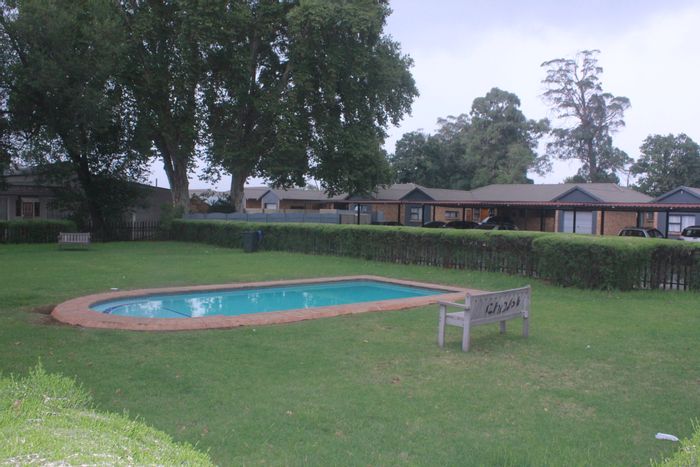 For Sale: Townhouse in Comet with private patio, security features, and pet-friendly amenities.