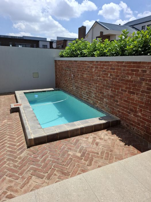 House To Rent in Helderzicht Eco Estate: 3 beds, pool, double garage, open-plan living.