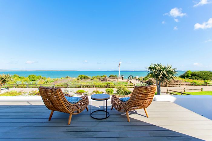 Beachfront House For Sale in Calypso Beach: 5 beds, 5 baths, ocean views.