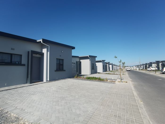 The Conifers Apartment For Sale: Eco-friendly living with private garden and open parking.