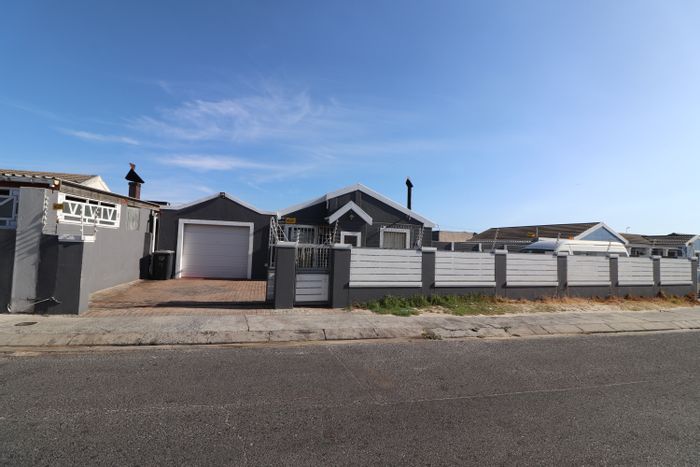For Sale: House in Strandfontein with pool, garage, and close to amenities.
