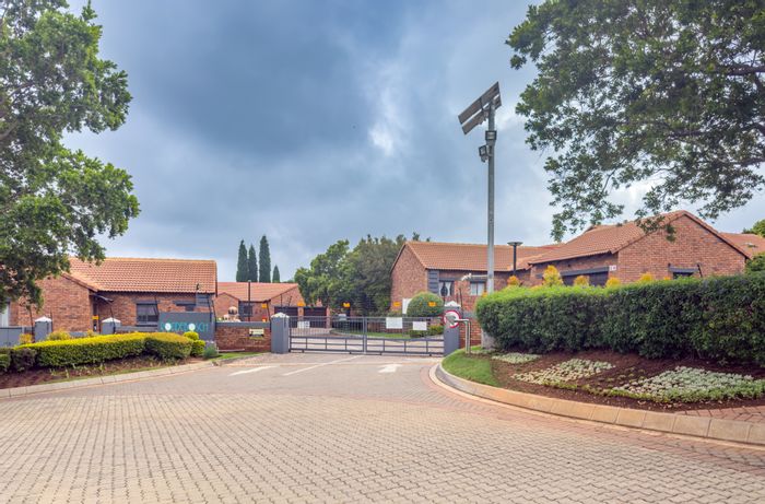 To Rent: Townhouse in Mooikloof Ridge with gardens, double garage, and estate amenities.