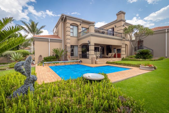 For Sale: House in Featherbrooke Estate with pool, study, and 4 garages.