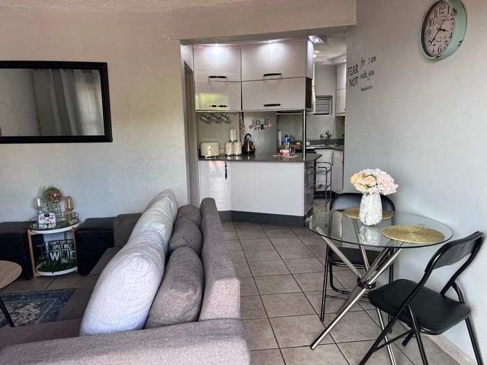 For Sale: Glenmore Townhouse with 2 bedrooms, secure parking, near amenities.