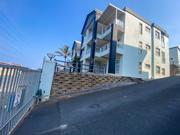 For Sale: Ocean-view apartment in Margate Beach with private patio and secure garage.