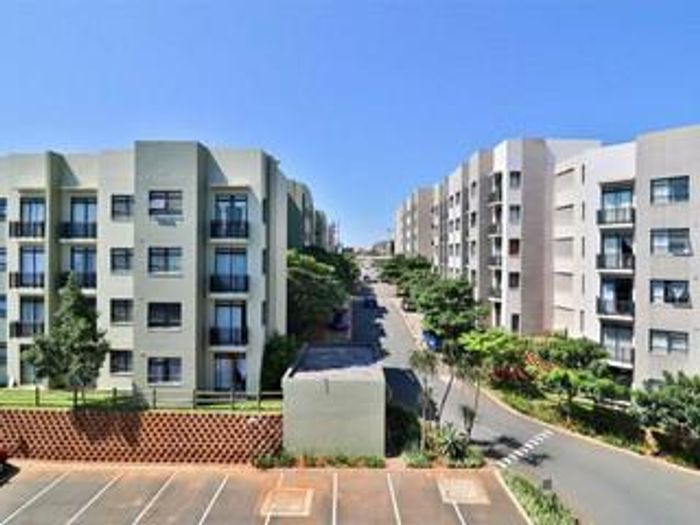 For Sale: Apartment in Umhlanga Ridge with security, pools, and fiber connectivity.