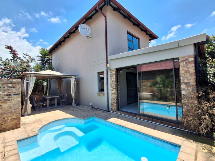 For Sale: Broadacres Townhouse with pool, entertainment room, and ample parking.