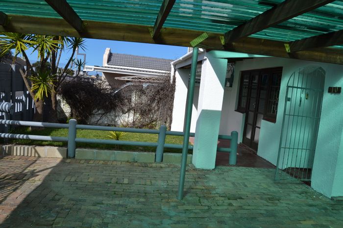 For Sale: Strandfontein Townhouse with flatlet, garage, and close to amenities.