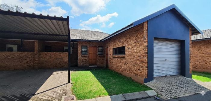 For Sale: 3-Bedroom Townhouse in Comet with secure parking and easy access.