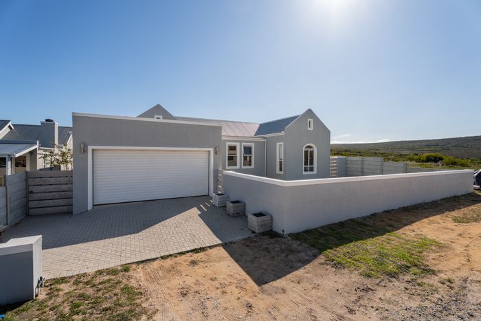 For Sale: House in Agulhas Central with open-plan living, braai area, and mountain views.