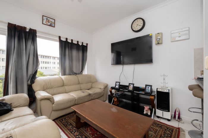 For Sale: Apartment in Rome with two bedrooms, balcony, secure parking, and transport access.