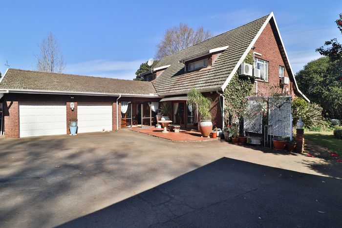 For Sale: Leonard House with double garage, pool, and separate cottage.