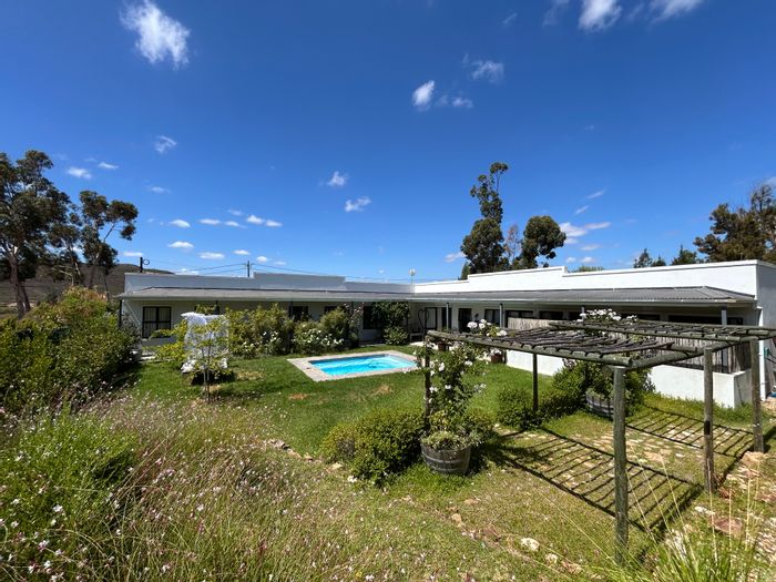 For Sale: Unique McGregor Central house with three units, plunge pool, and nature reserve access.