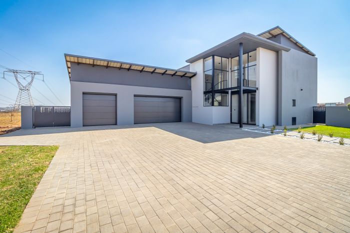 For Sale: House in Midstream Estate with pool, braai room, and three garages.