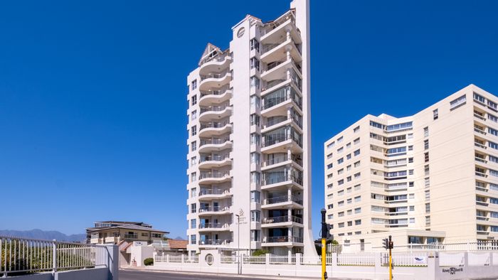 For Sale: Beachfront Apartment in Strand North with 3 Bedrooms and Exclusive Amenities.