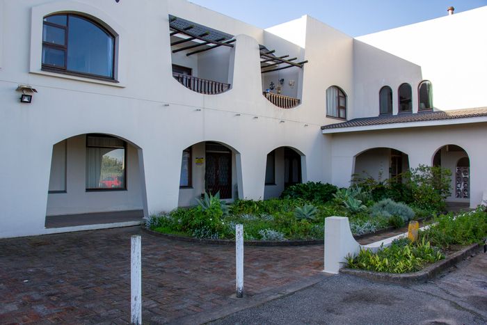 For Sale: Beachside Townhouse in West Beach with 3 bedrooms, balcony, and garage.