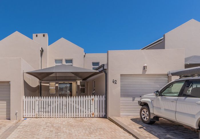 For Sale: Townhouse in Country Club with open-plan living, indoor braai, and garage.