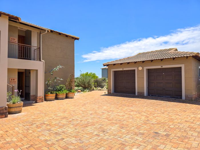 For Sale: Apartment in Langebaan Country Estate with two bedrooms, garage, and outdoor space.