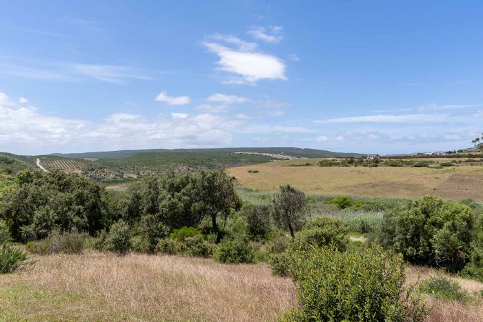 For Sale: Farm in Stilbaai Rural with river frontage, grazing camps, and cottages.