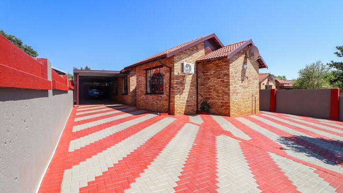 For Sale: House in Tlhabane West with three bedrooms, carport, and electric gates.