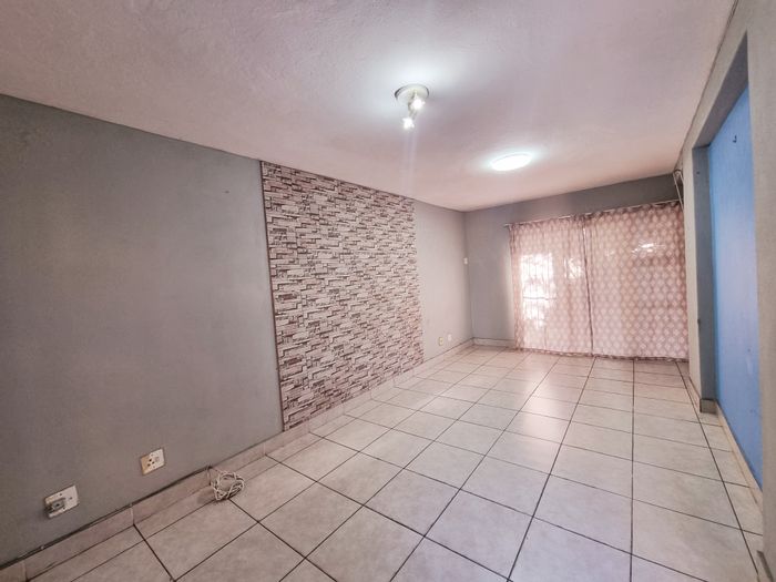 3-Bedroom Apartment For Sale in Arboretum with private backyard and secure parking.