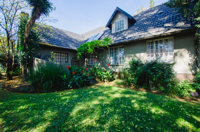 For Sale: Family-friendly Parkrand house with pool, bachelor pad, and ample outdoor space.