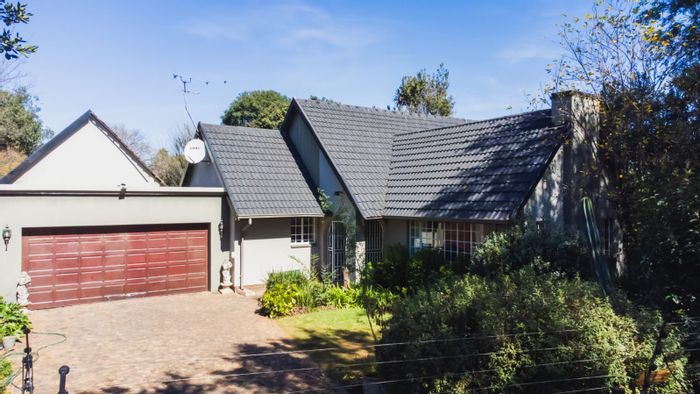 For Sale: Family-friendly Parkrand house with pool, bachelor pad, and ample outdoor space.