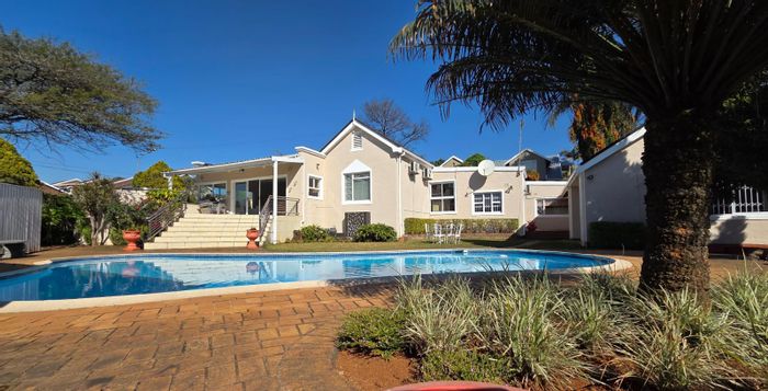 For Sale: Spacious Clarendon house with pool, study, and dual lounges.