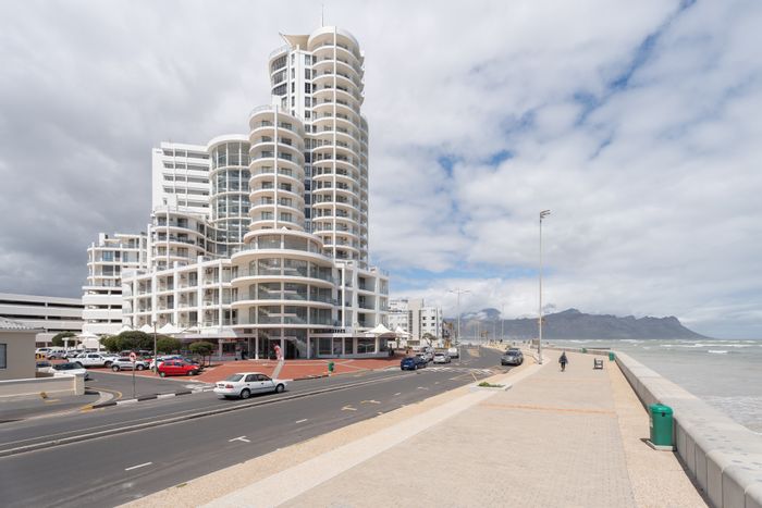 For Sale: Apartment in Strand North with balcony, pool, gym, and secure access.