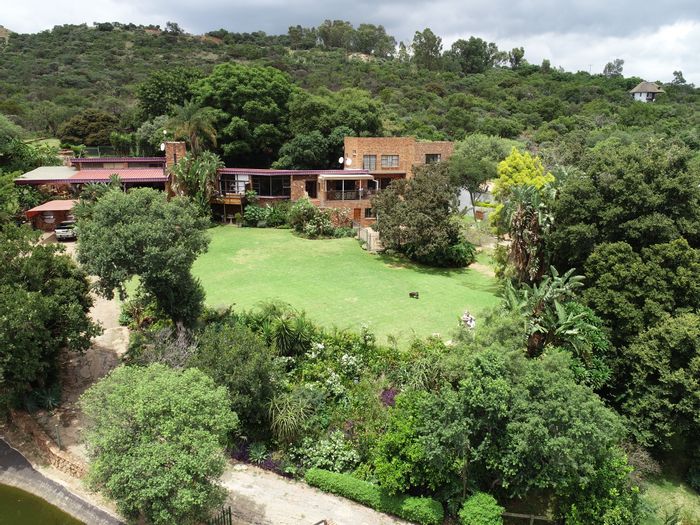 For Sale: Zandfontein AH Farm with equestrian facilities, homes, and panoramic views.