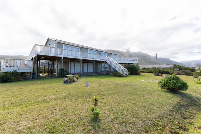 Lake views, wheelchair-friendly, 4 beds, flatlet, double garage in Bettys Bay Central. For Sale.