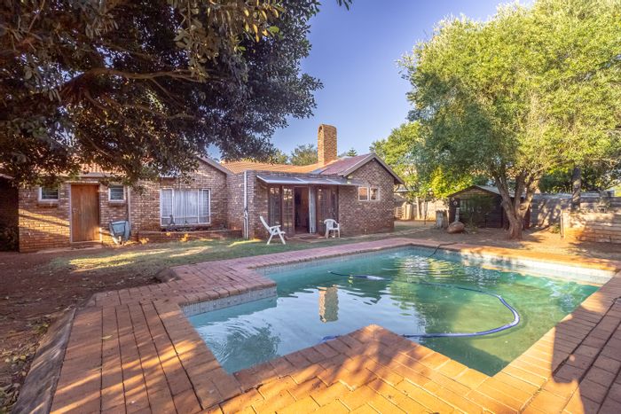 For Sale: Spacious Doornpoort house with pool, study, garden, and security features.