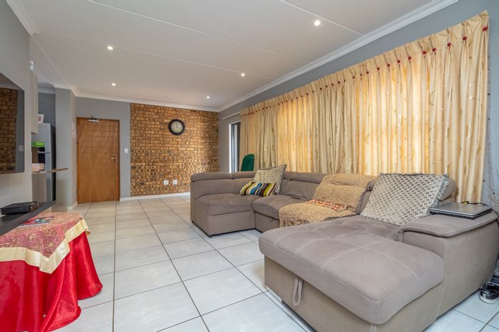 Top-floor 3-bedroom apartment in Homes Haven, secure complex with balcony and braai.