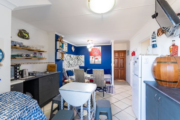 Rooftop apartment in Whispering Pines with balcony, pool, and parking. For Sale.